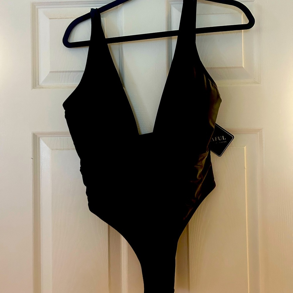 Black plunge one piece bathing suit